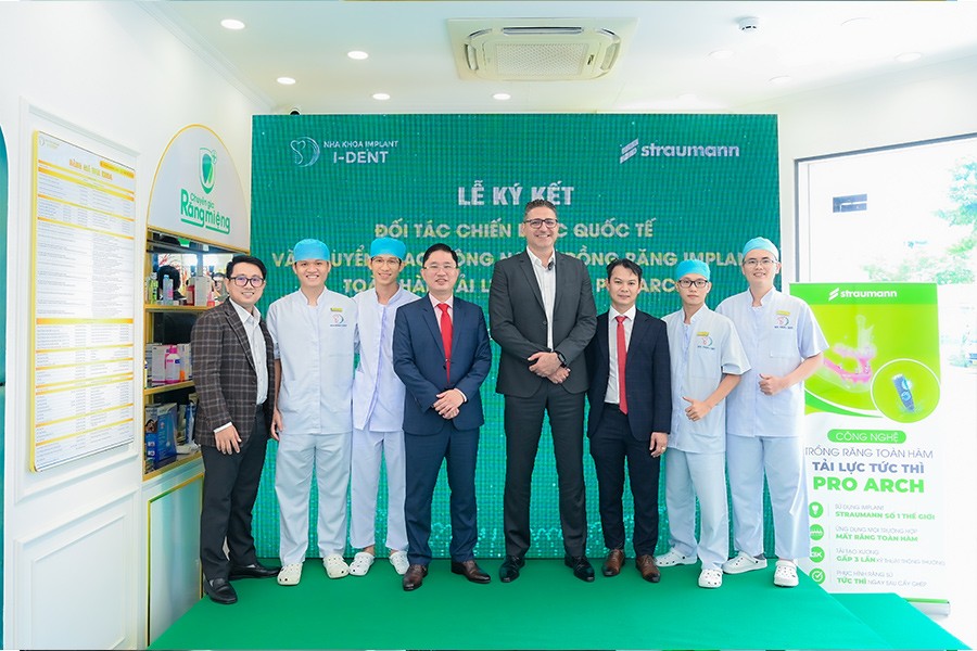 The team of I-DENT dentists and invited guests attending the signing ceremony