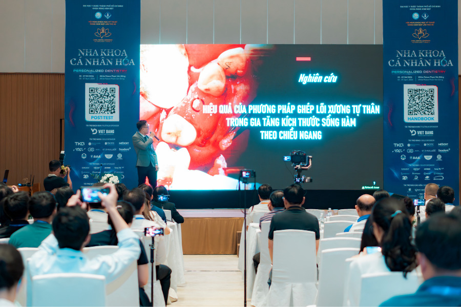 Bác sĩ Thành Luân báo cáo tại hội nghị