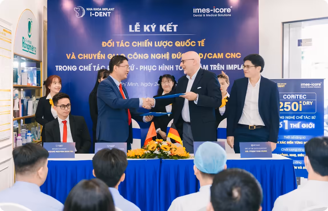 Representatives from both parties signing the agreement